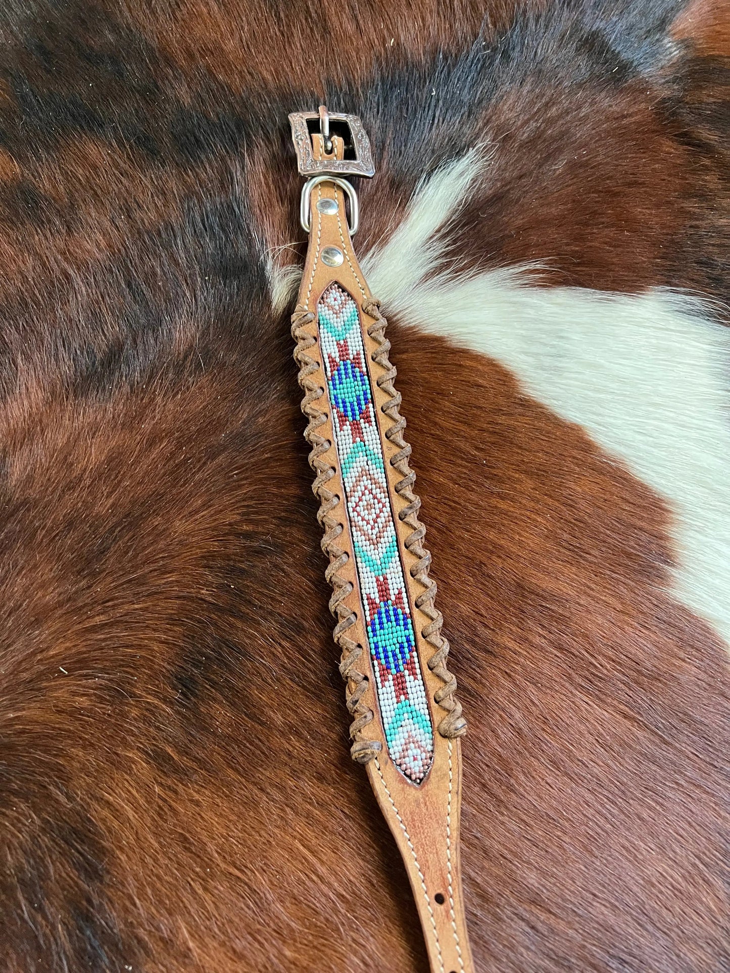 Genuine leather dog collar with white, teal, and burgundy southwest beaded inlay designa leather wrapped edge and copper hardware.